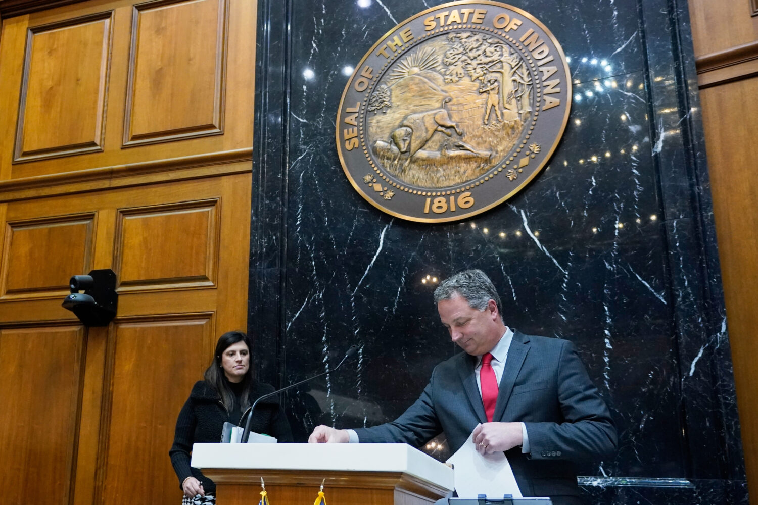 FILE - Indiana Republican House Speaker Todd Huston leaves the podium in the house chamber at the S...