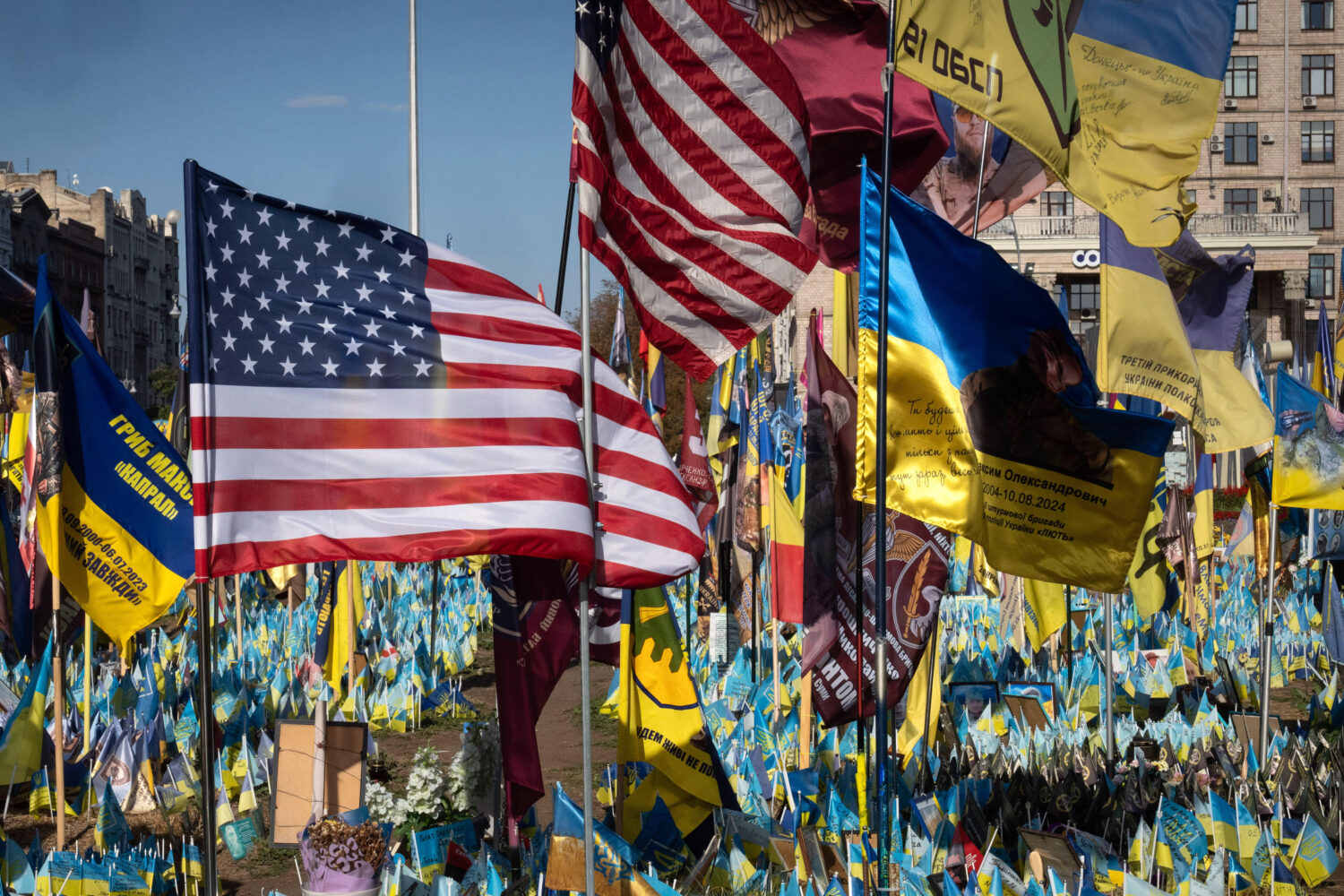 FILE - US and Ukrainian national flags wave to commemorate American volunteers, who were killed in ...