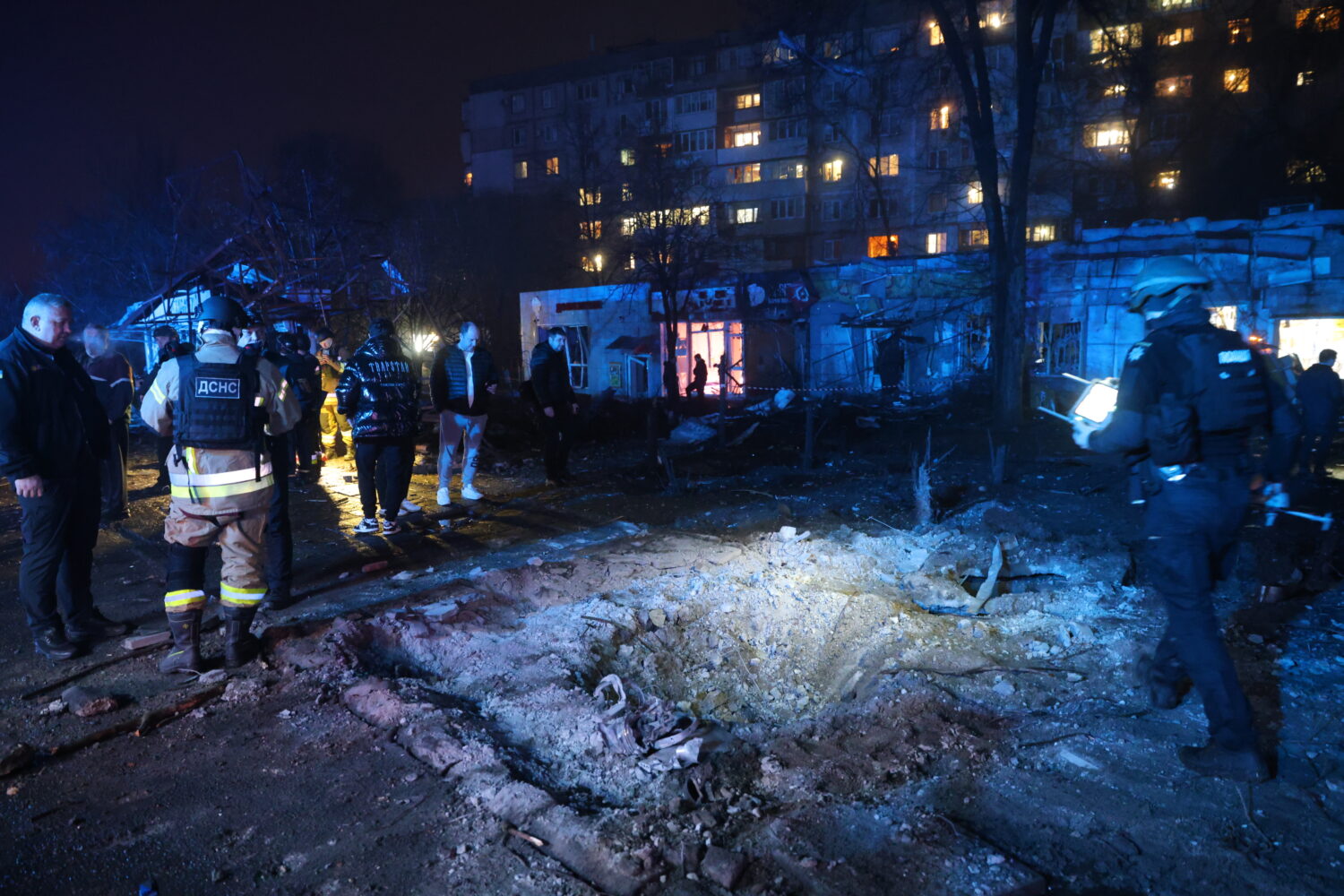 A crater is seen at a market destroyed by a Russian airstrike on Zaporizhzhia, Ukraine, Friday, Nov...