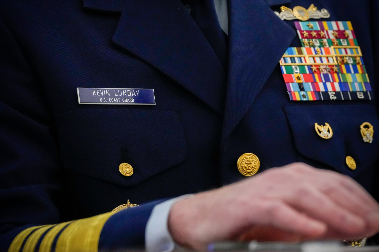 The name tag and ribbons of Adm. Kevin Lunday, acting commandant of the U.S. Coast Guard, are visib...