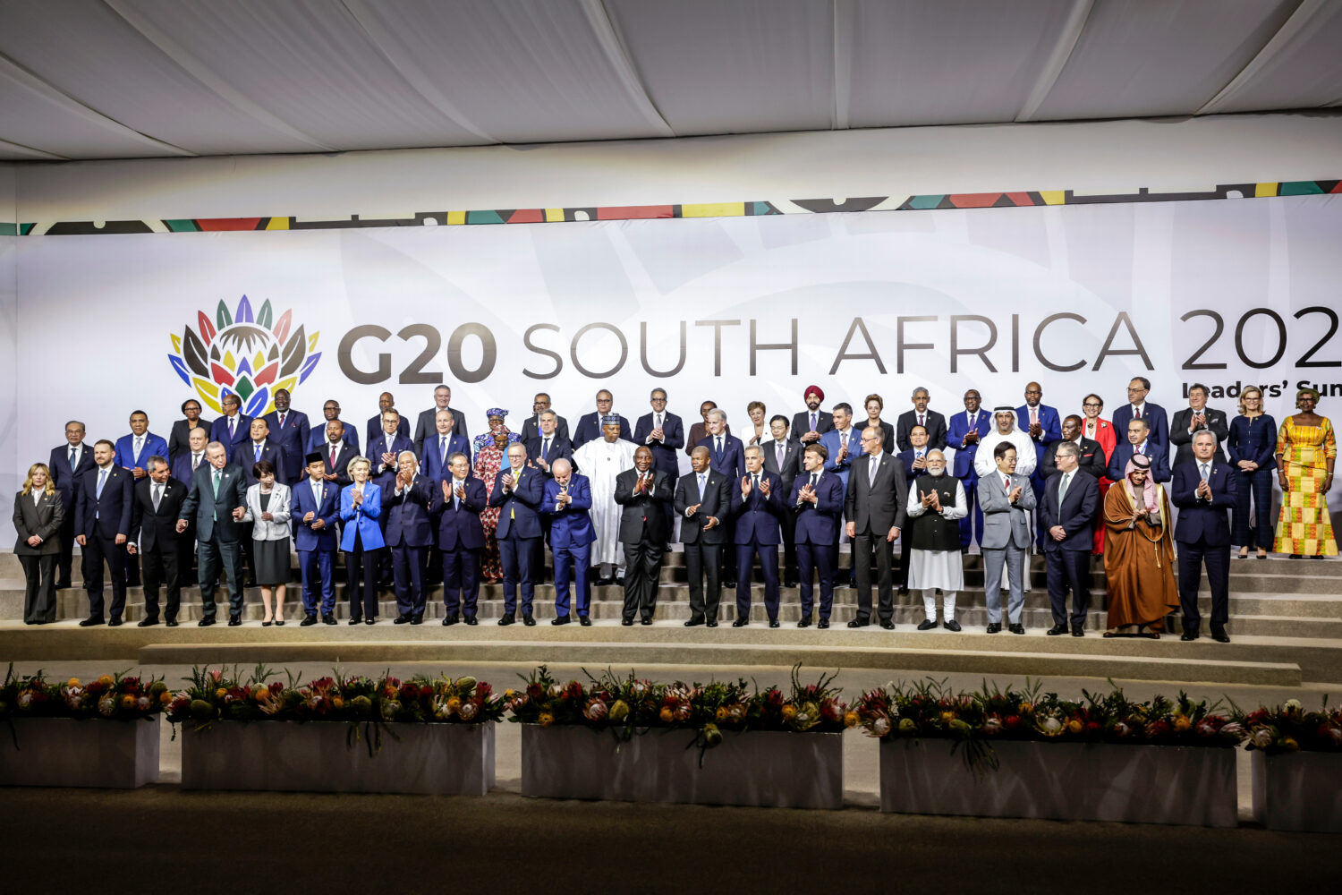 Leaders and delegates pose for a group photo, on the opening day of the G20 Leaders' Summit, in Joh...