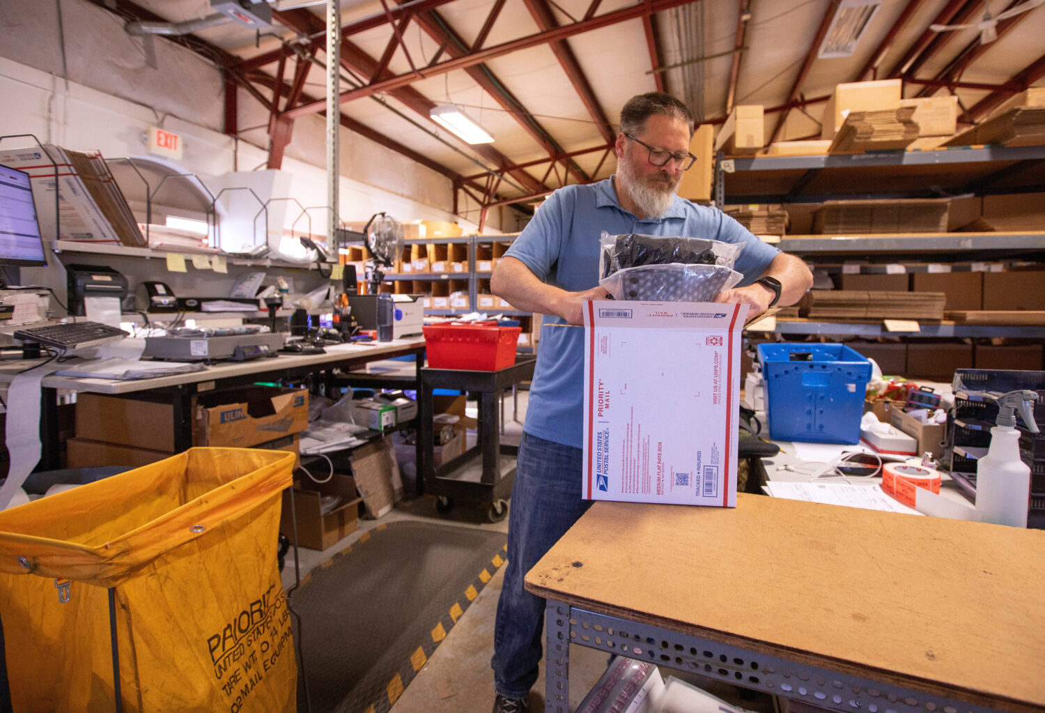FILE - Terry Precision Cycling warehouse manager Luke Tremble packs orders at the company’s wareh...