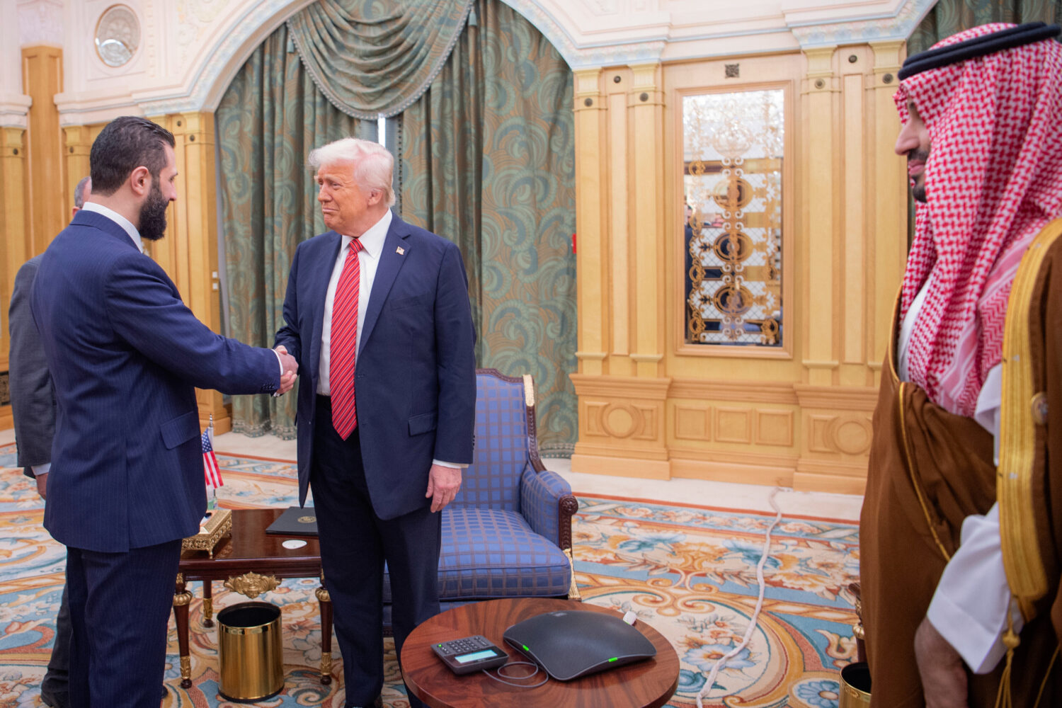 FILE - In this photo provided by the Saudi Royal Palace, Syria's interim President Ahmad al-Sharaa,...
