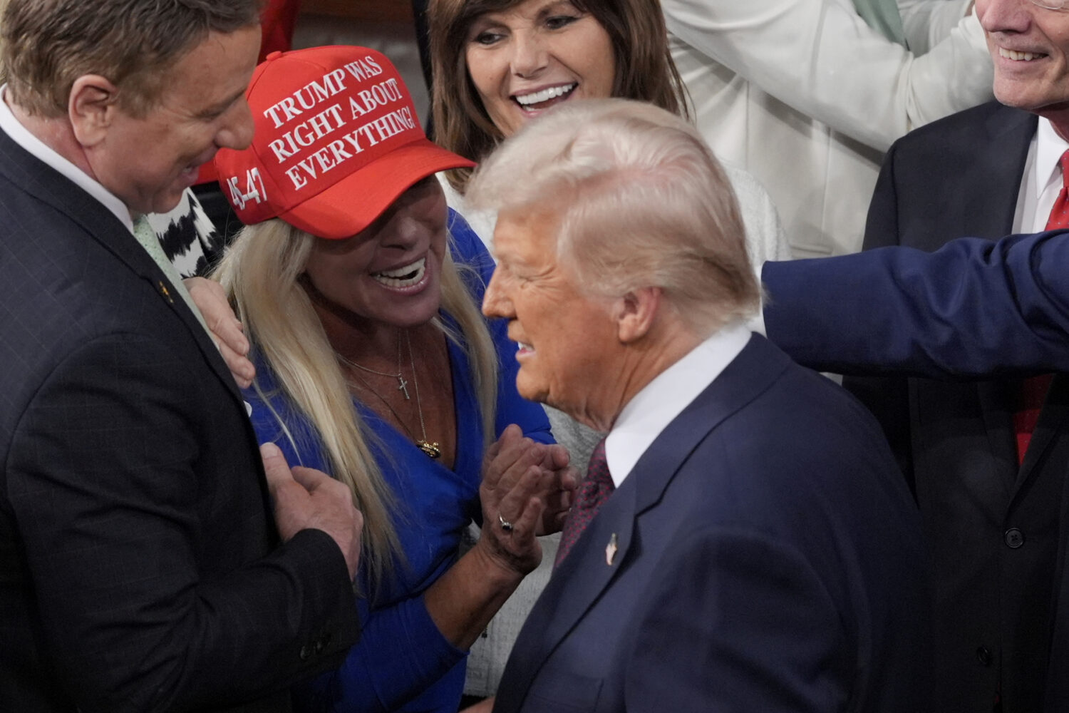 FILE - President Donald Trump arrives and walks by Rep. Marjorie Taylor Greene, R-Ga., to address a...