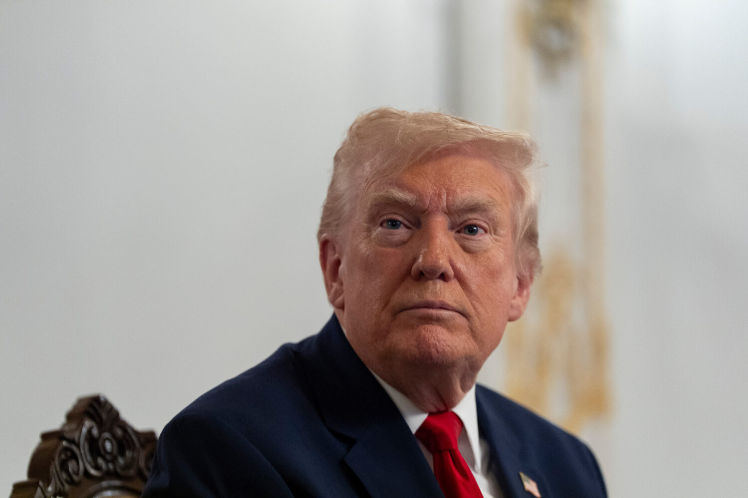 President Donald Trump speaks to reporters after speaking to troops via video from his Mar-a-Lago e...