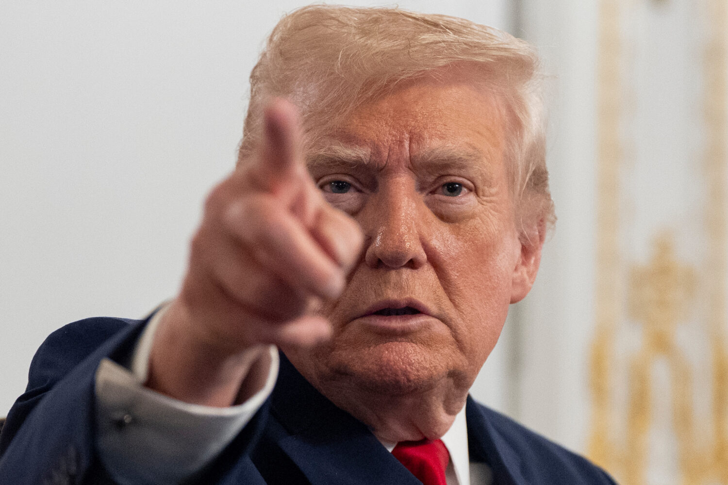 President Donald Trump speaks to reporters after speaking to troops via video from his Mar-a-Lago e...