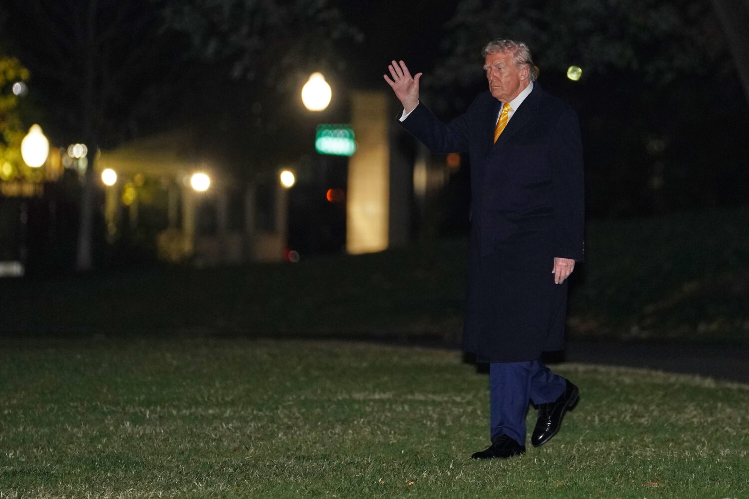 President Donald Trump waves as he walks to board Marine One, Friday, Nov. 14, 2025, on the South L...
