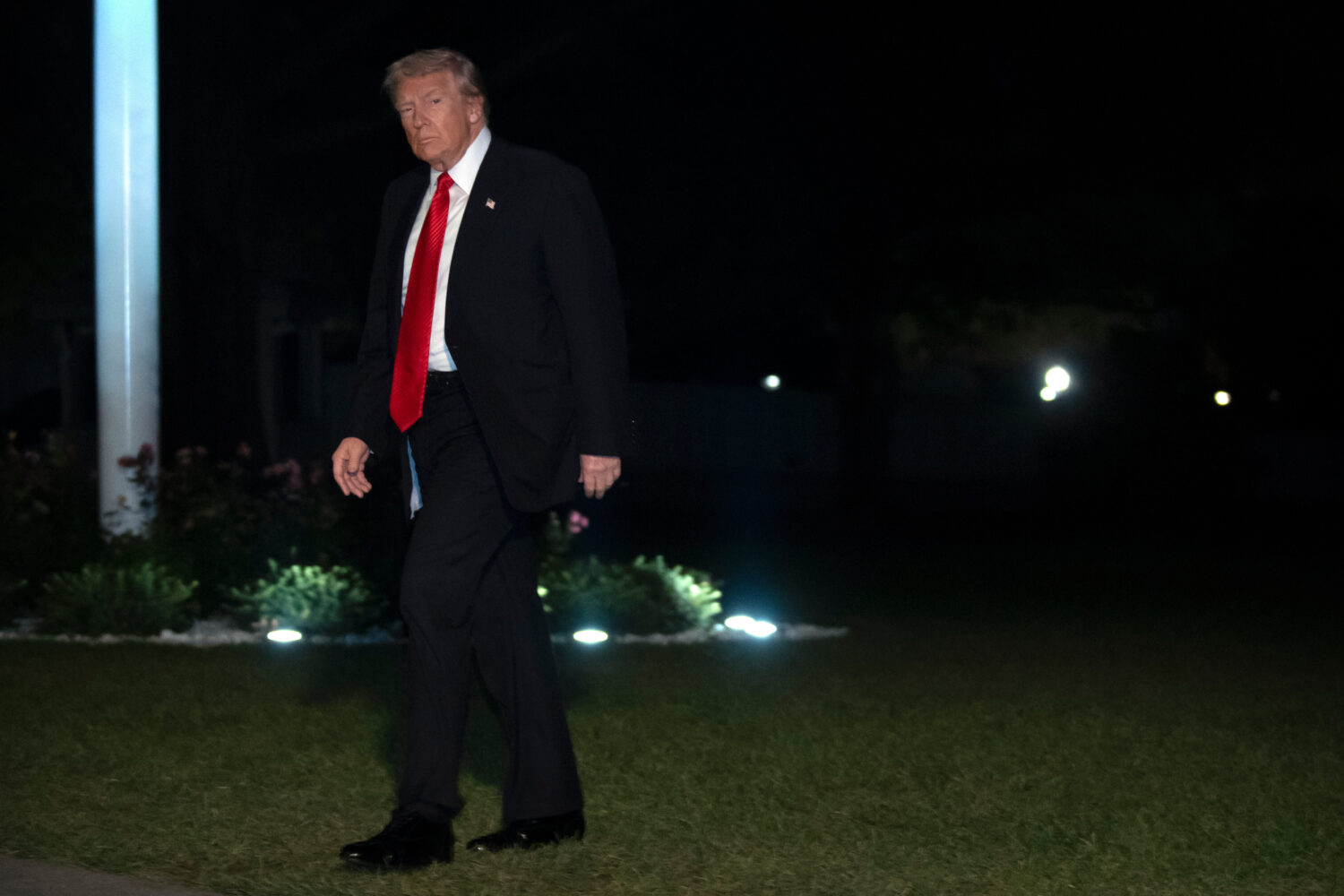 President Donald Trump walks across the South Lawn of the White House, Sunday, Nov. 2, 2025, in Was...