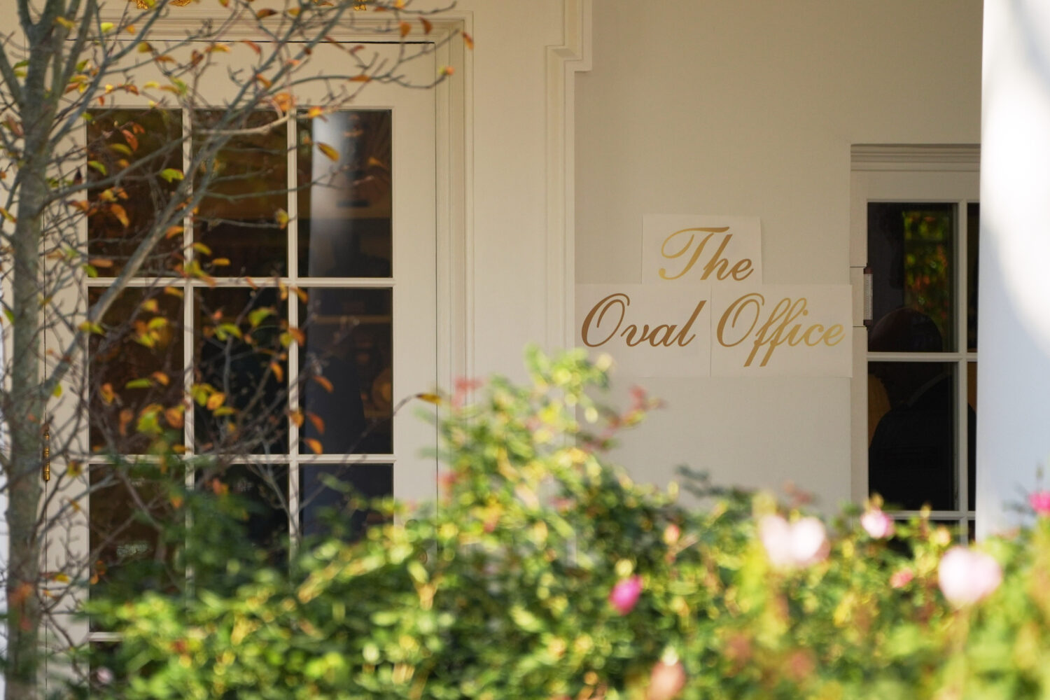 A sign is seen outside the Oval Office before President Donald Trump walks out to board Marine One ...
