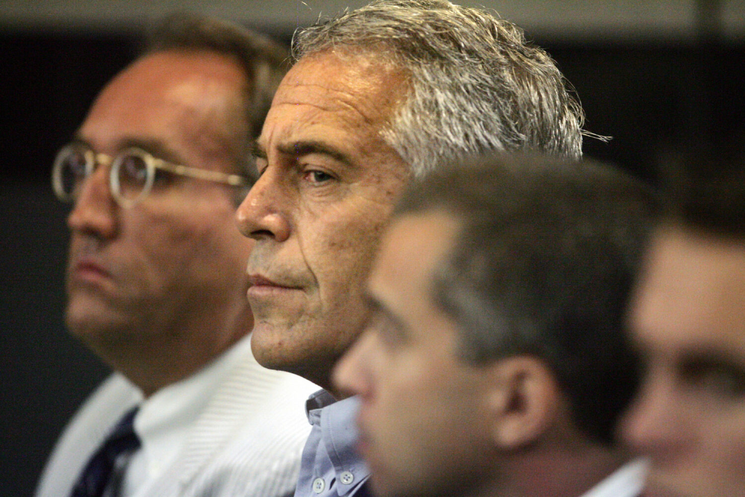 FILE - In this July 30, 2008, file photo, Jeffrey Epstein, center, appears in court in West Palm Be...