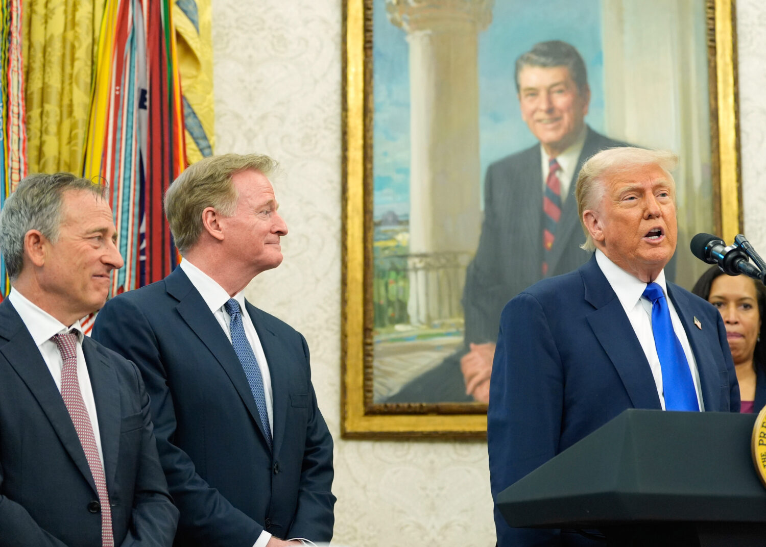 FILE - President Donald Trump speaks as Washington Commanders owner Josh Harris, from left, NFL Com...