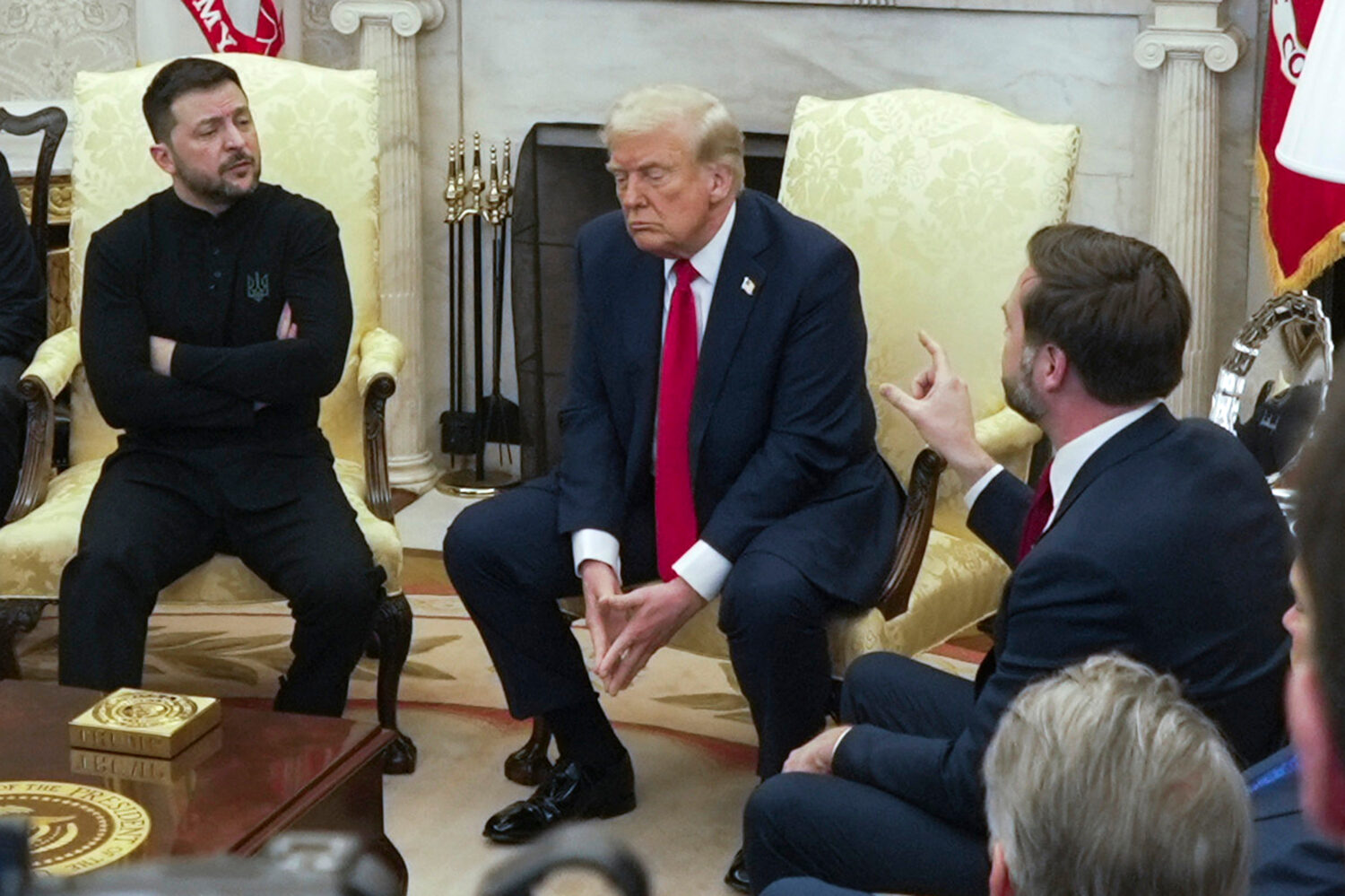 FILE - Vice President JD Vance, right, speaks with Ukrainian President Volodymyr Zelenskyy, left, a...