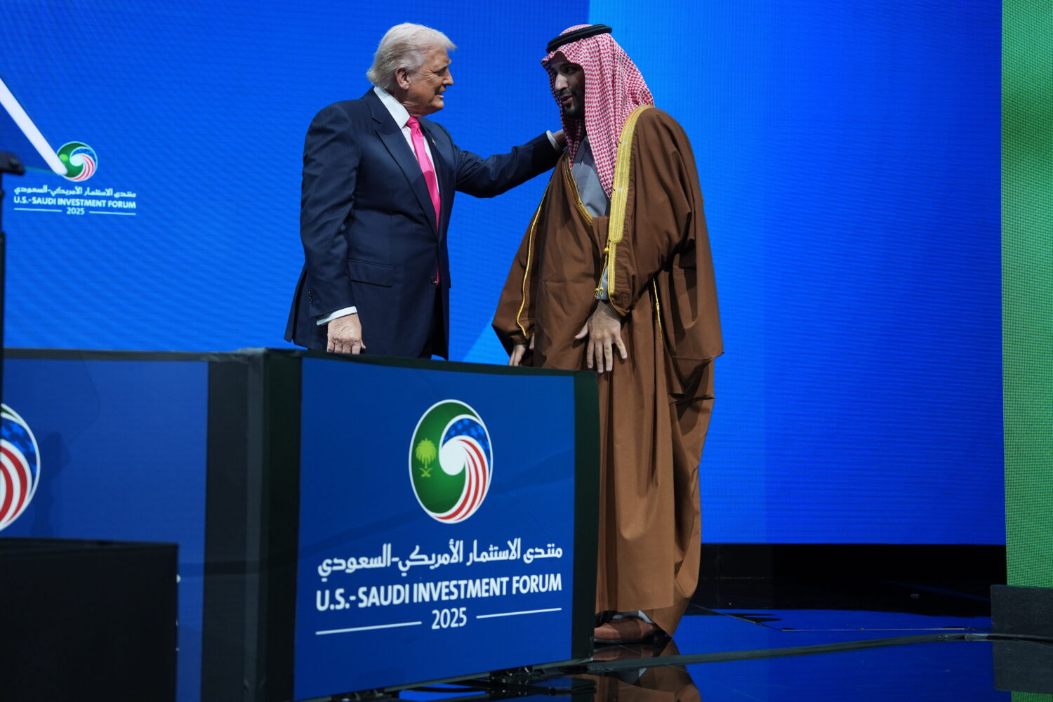 President Donald Trump speaks with Saudi Arabia's Crown Prince Mohammed bin Salman during the Saudi...