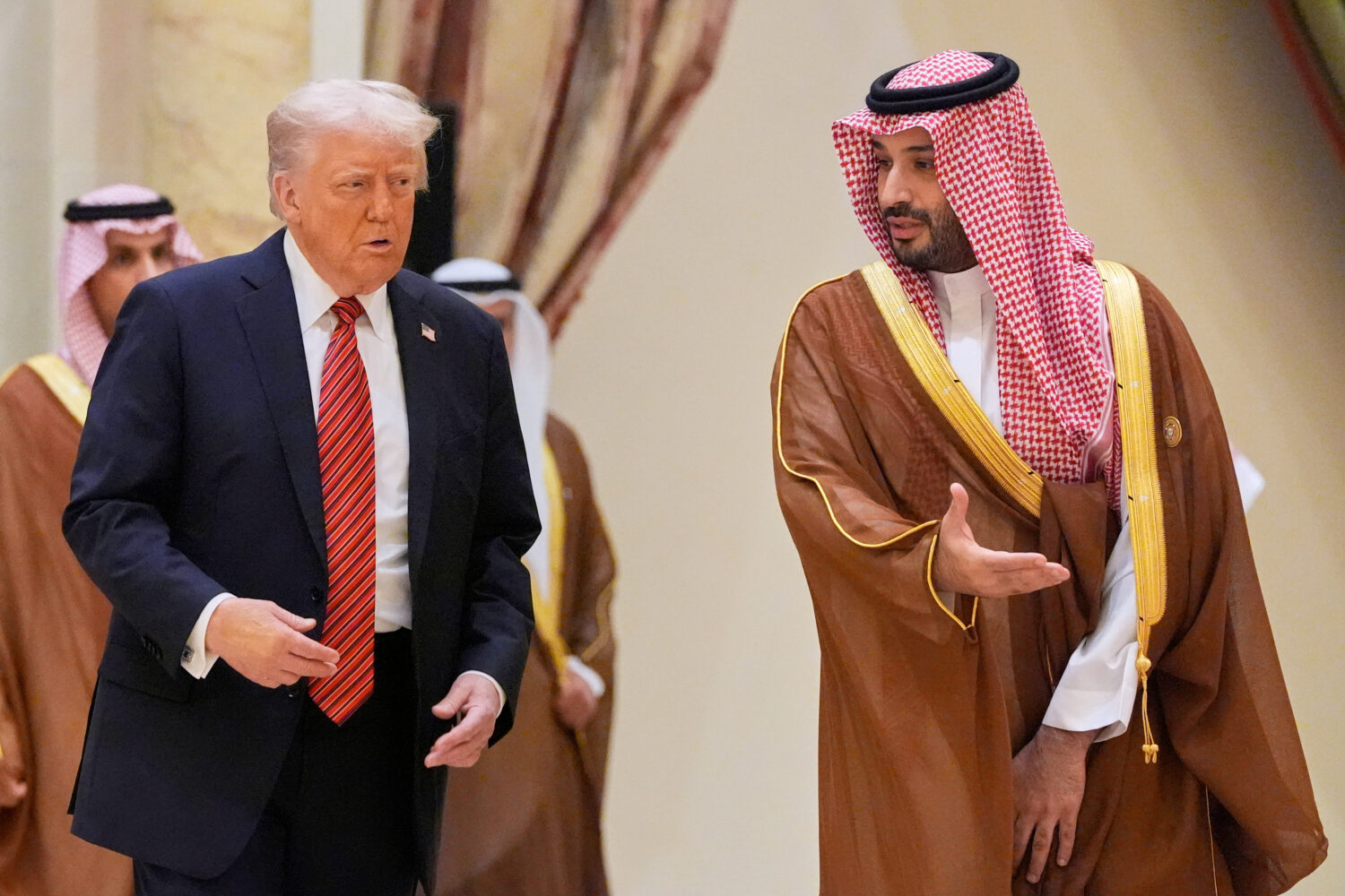 FILE - President Donald Trump arrives with Saudi Crown Prince Mohammed bin Salman for the group pho...