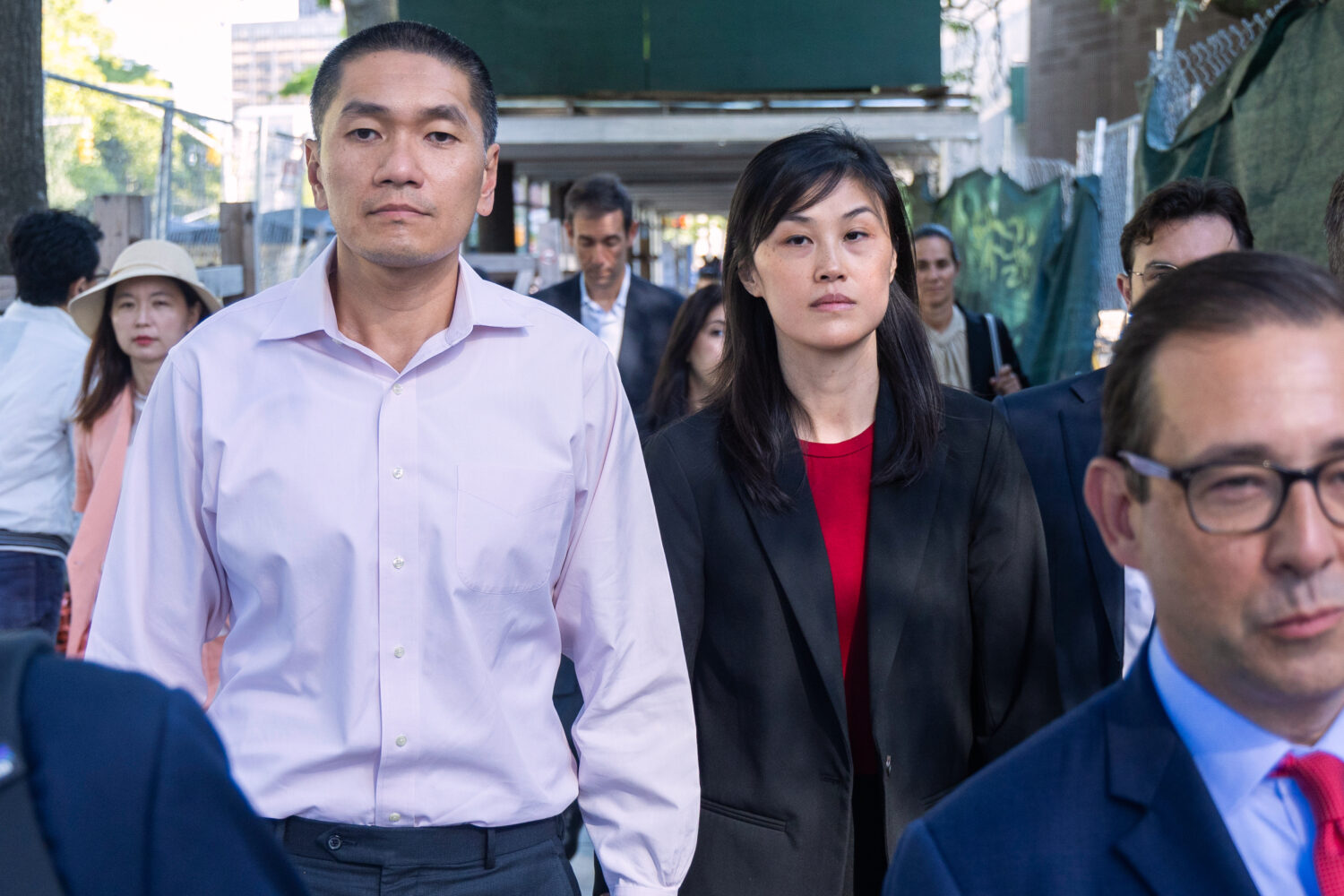 FILE - Former New York Governor Kathy Hochul aide Linda Sun and her husband, Christopher Hu, leave ...
