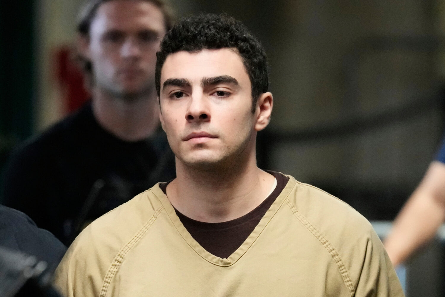 FILE - Luigi Mangione is escorted into Manhattan state court in New York, Sept. 16, 2025. (AP Photo...