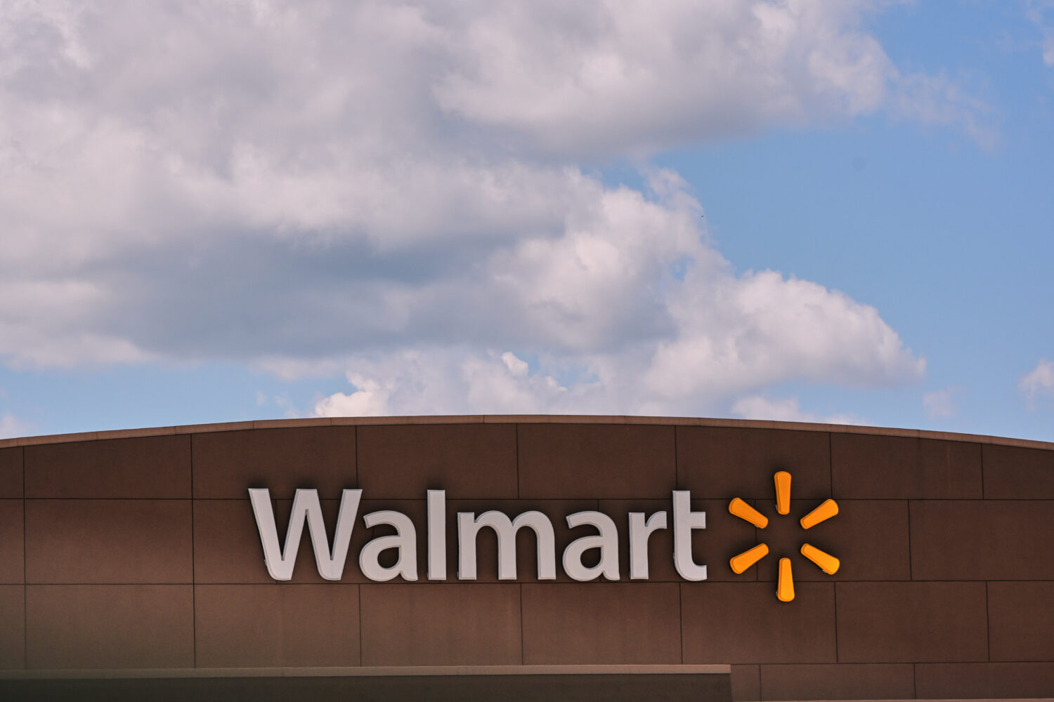 FILE - Clouds pass over the Walmart store, Thursday, Aug. 14, 2025, in Manchester, N.H. (AP Photo/C...