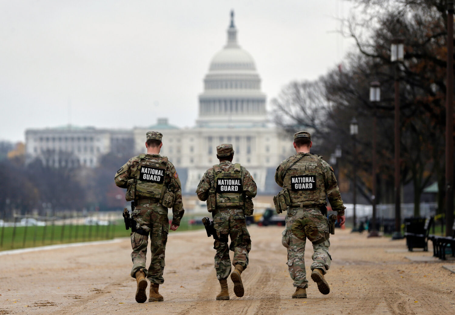 National Guard patrol along the National Mall in front of the Capitol, Wednesday, Nov. 26, 2025, in...