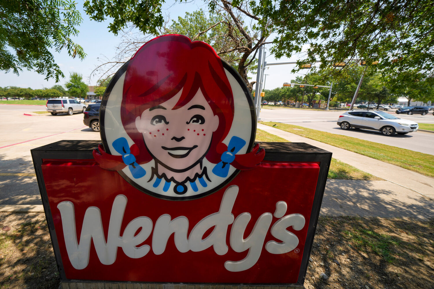 FILE - A sign is seen at a Wendy's restaurant Tuesday, Aug. 5, 2025, in Garland, Texas. (AP Photo/J...
