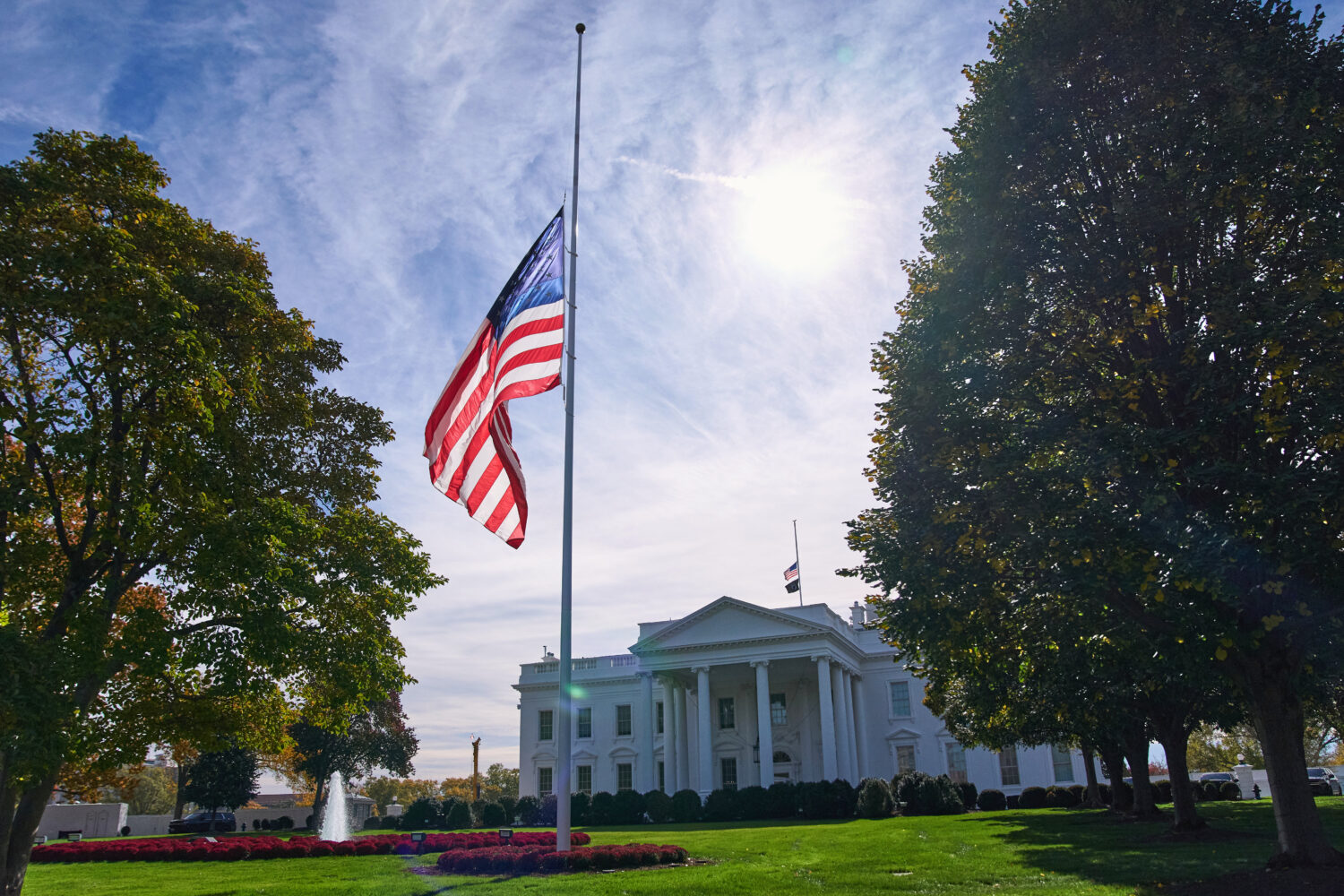 The American flag is seen at half-staff, Tuesday, Nov. 4, 2025, at the White House in Washington. (...