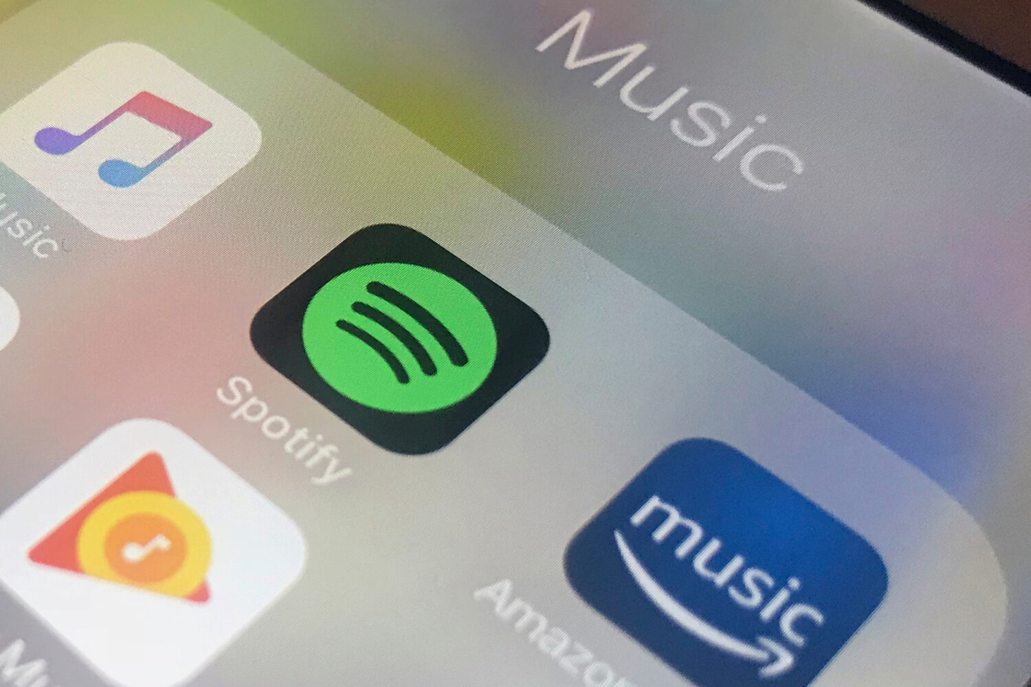 FILE - This Sunday, Jan. 28, 2018, photo shows music streaming apps clockwise from top left, Apple,...