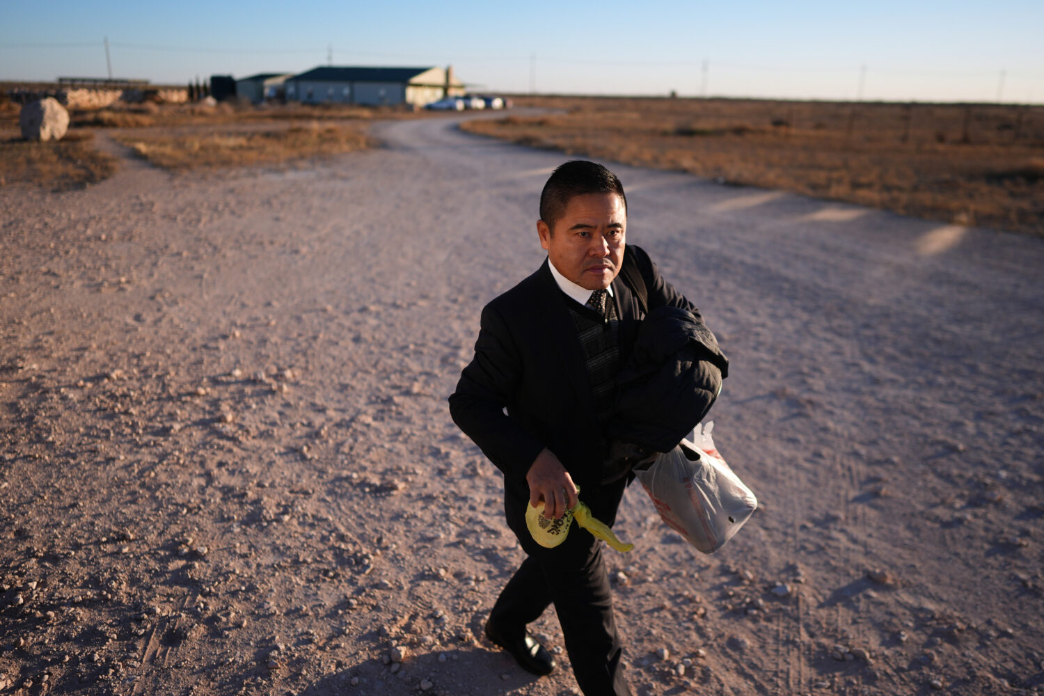 Former Chinese official Li Chuanliang walks between buildings in the Mayflower Church community, in...
