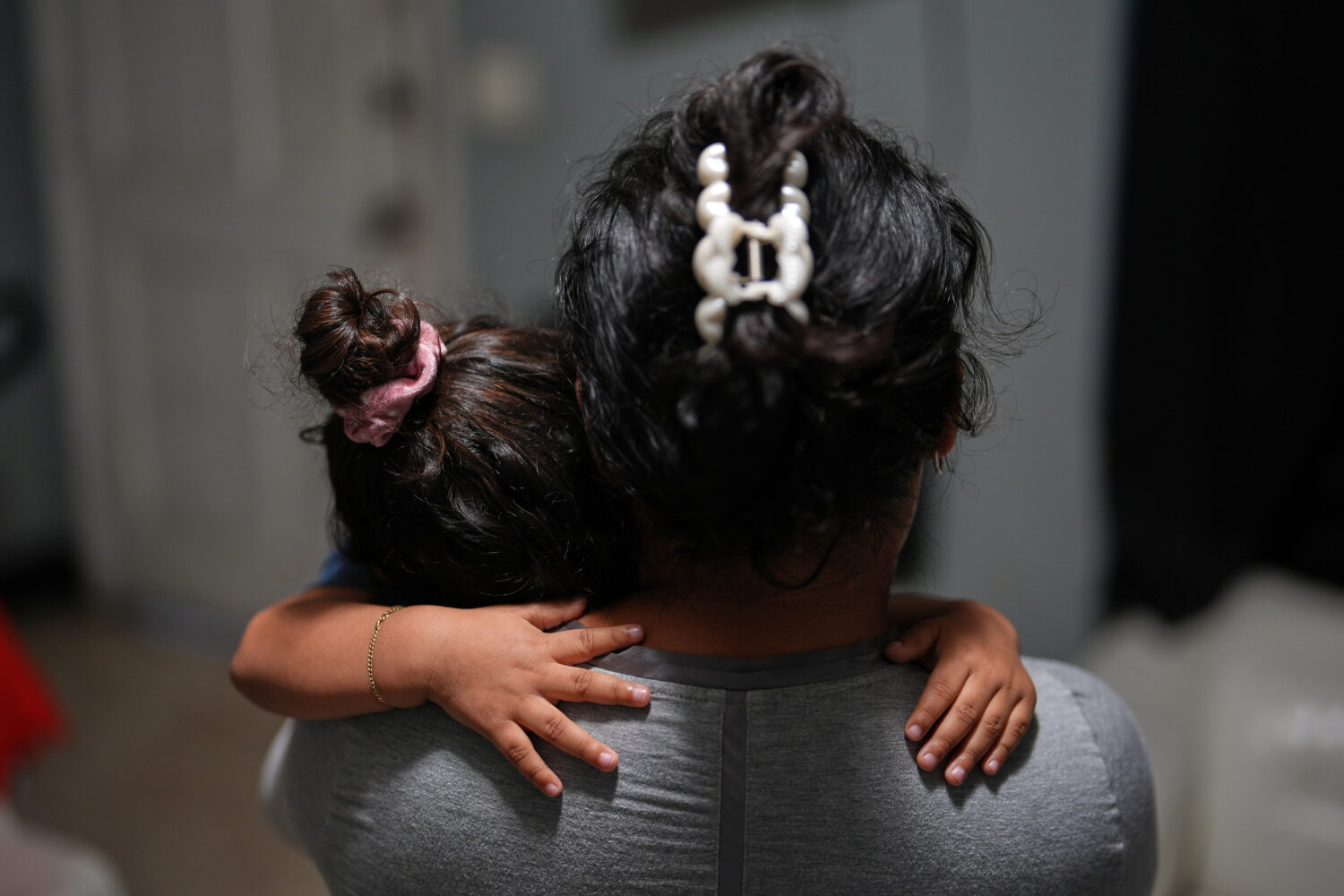 Pregnant asylum-seeker Yaoska, 32, comforts her two-year-old son who was not feeling well, inside t...