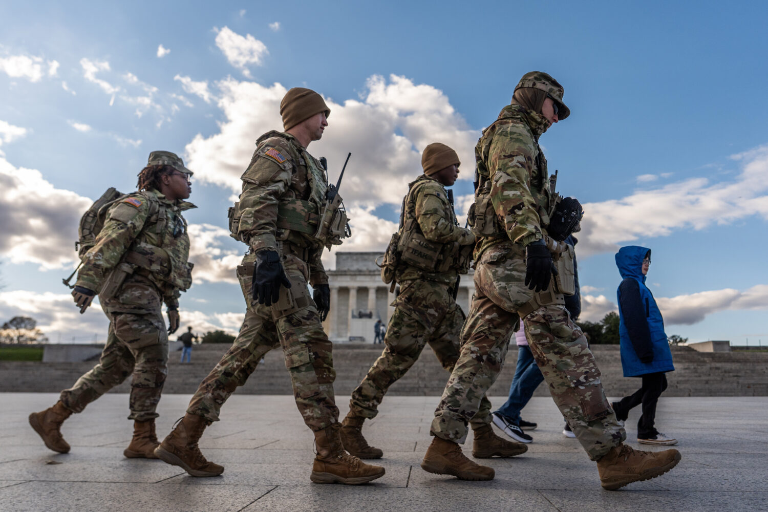 Members of the National Guard patrol in front of the Lincoln Memorial on the National Mall, Friday,...