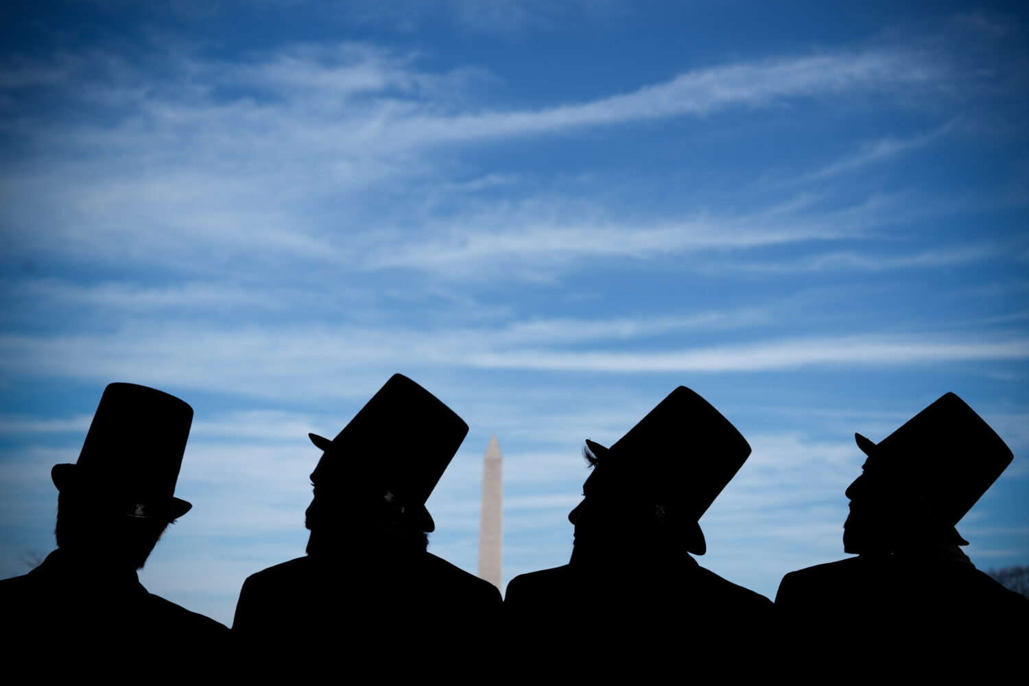 Men dressed as former President Abraham Lincoln attend a mock funeral for the penny, which was disc...