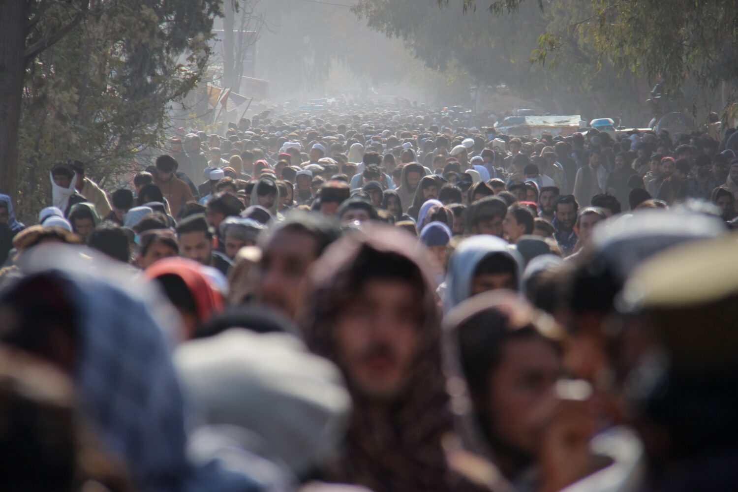 FILE - A crowd leaves a stadium after attending the public execution, carried out by Taliban author...