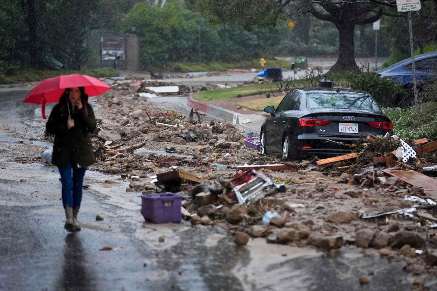 FILE - Mud and debris is strewn on Fryman Road during an atmospheric river Feb. 5, 2024, in Studio ...