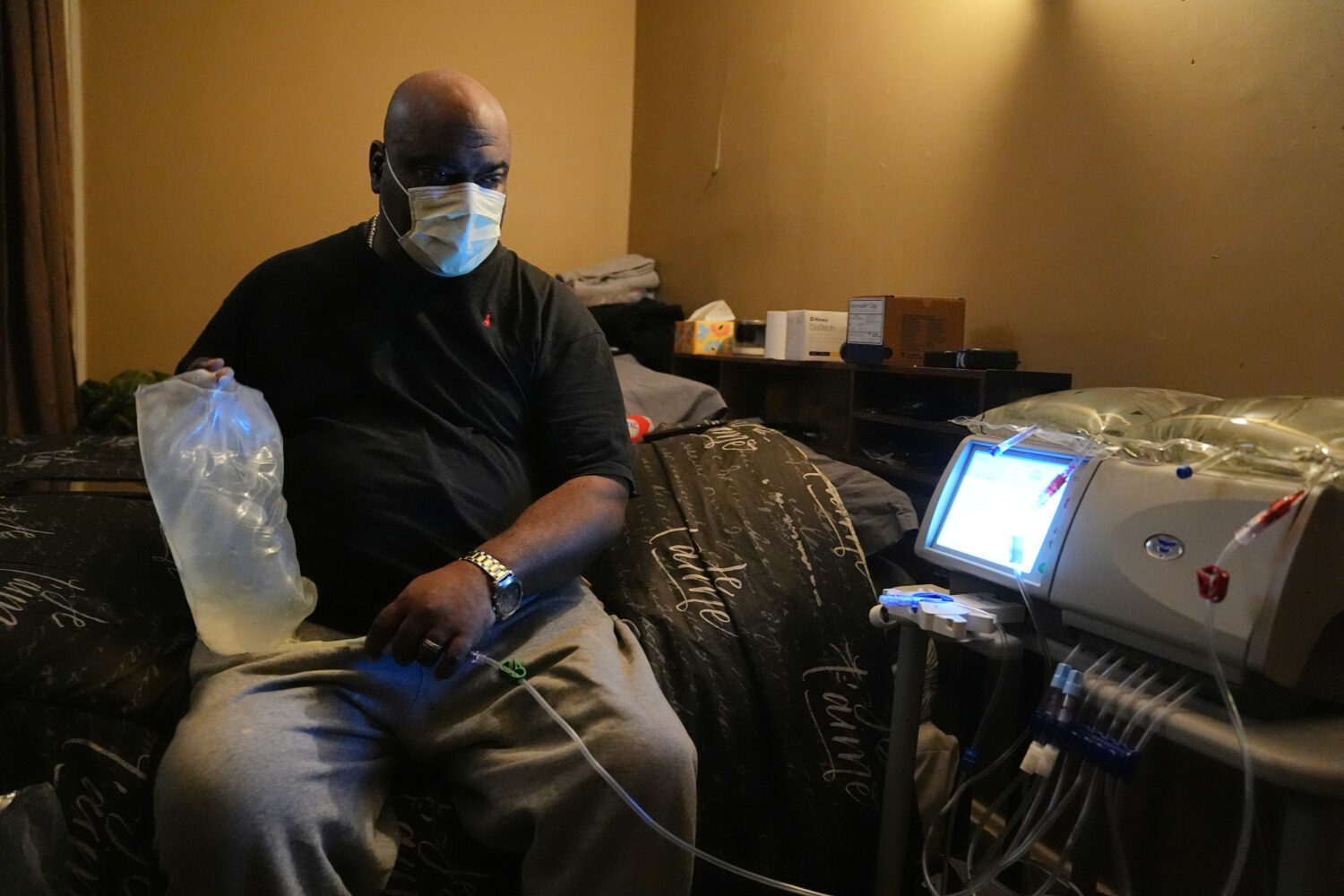 Ahmad Collins, a city government worker and former Penn State linebacker, prepares for his nightly ...