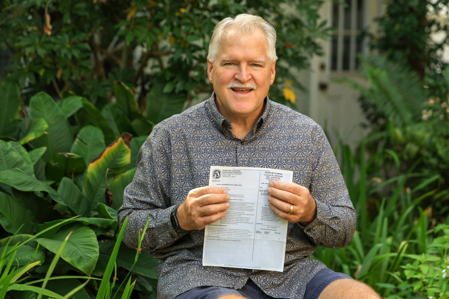 Joel Cleveland poses with his Florida bear hunting permit Friday, Dec. 5, 2025, in Tampa, Fla. Clev...