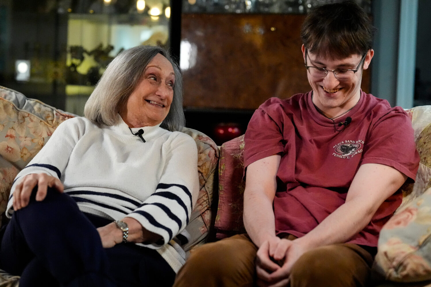 Donna West sits with her grandson Paul Quirk as they speak to a reporter, Tuesday, Dec. 2, 2025, in...