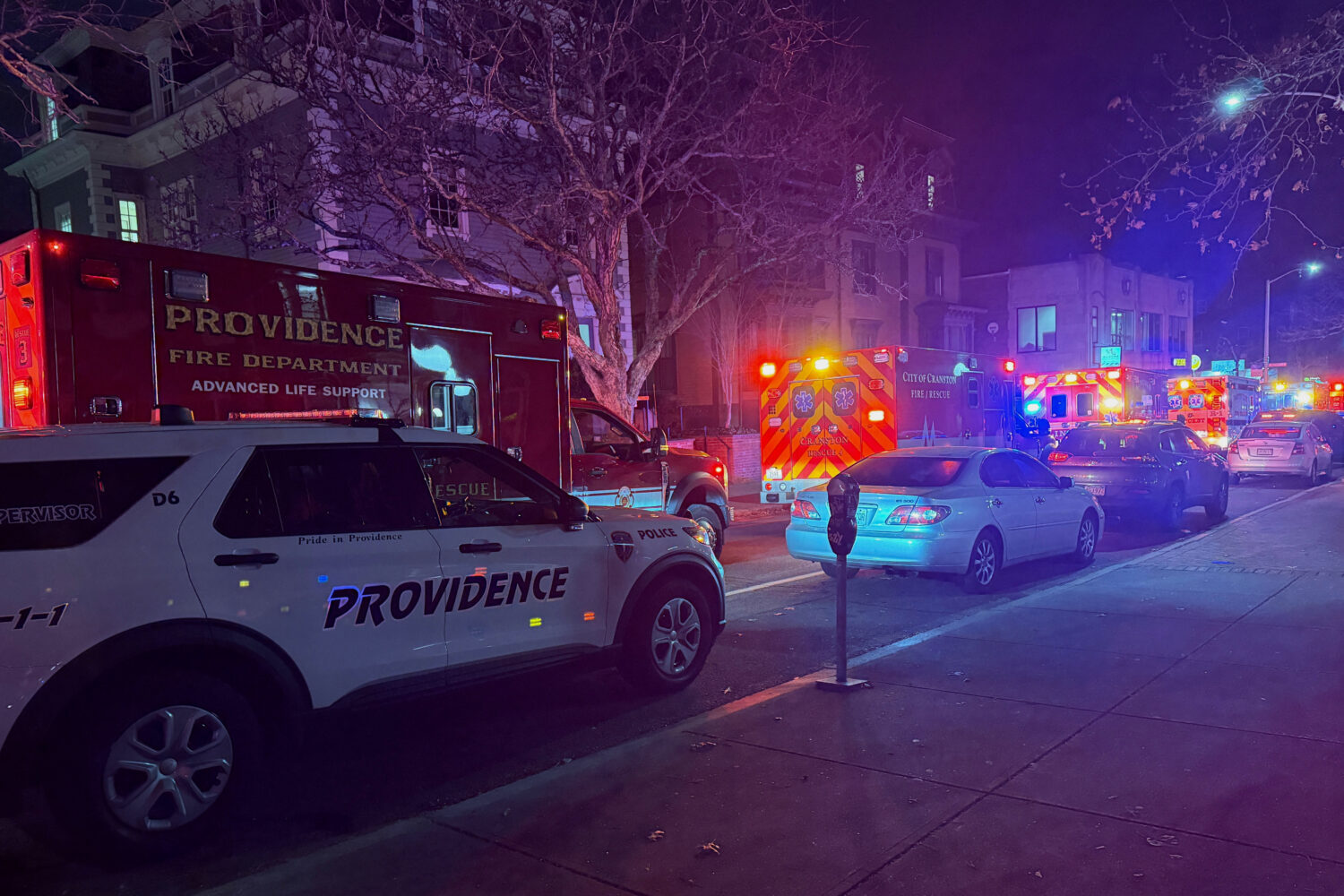 Police vehicles and first responders gather at Waterman St, and Thayer in response to a shooting, i...