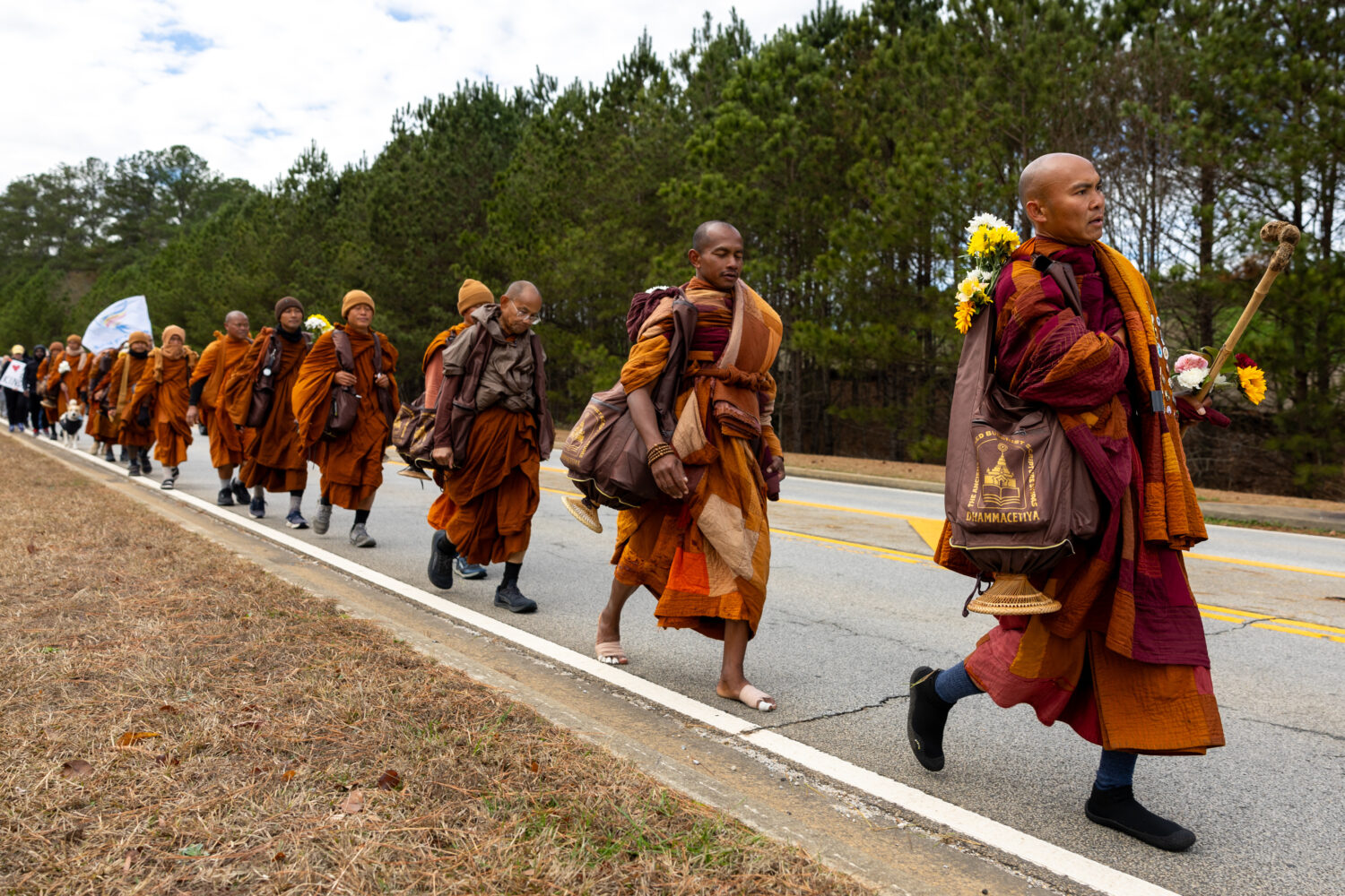Buddhist monks on a "Walk for Peace" walk on Veterans Parkway in Fayetteville, Ga., on Monday, Dec....