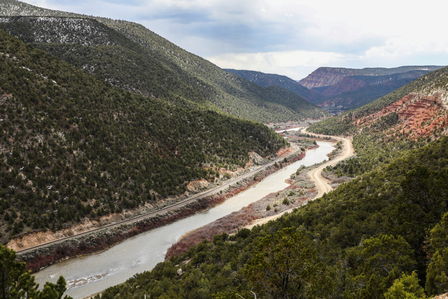 FILE - The Colorado River runs through mountains near Burns, Colo., on April 12, 2023. (Chris Dillm...