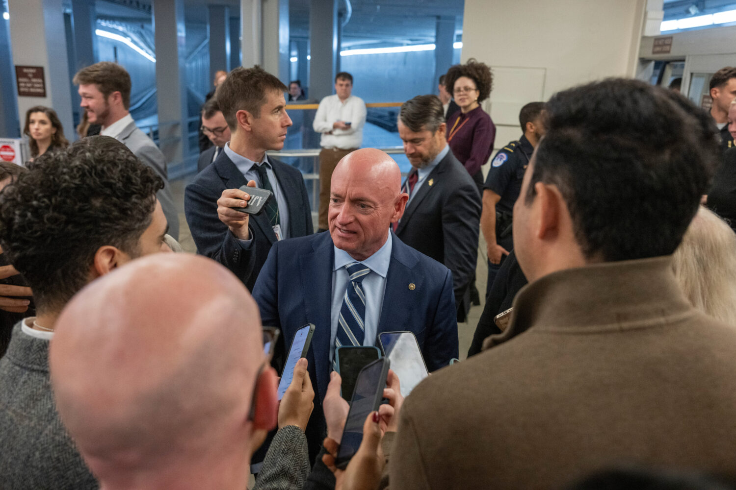 Sen. Mark Kelly, D-Ariz, speaks to reporters near the Senate Subway stakeout, Thursday, Dec. 4, 202...