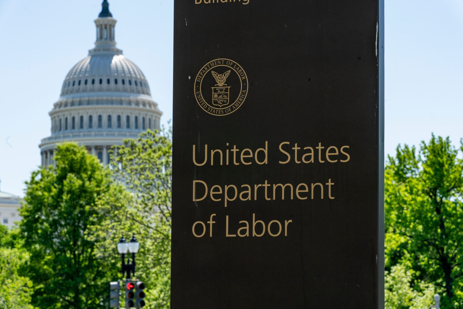 FILE - In this May 7, 2020, file photo, the entrance to the Labor Department is seen near the Capit...