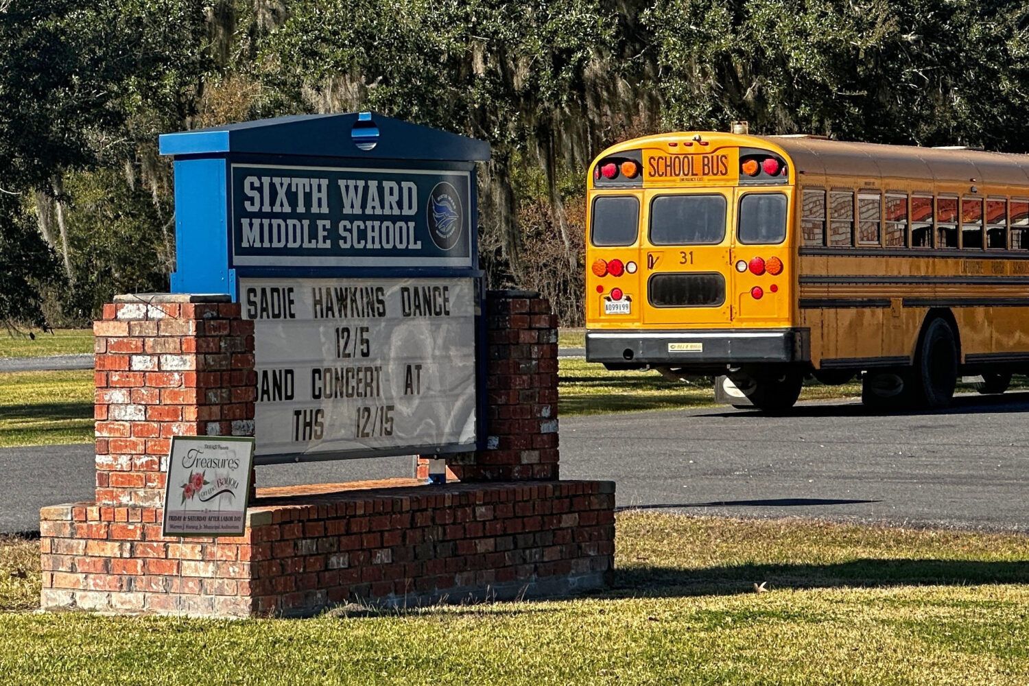 A school bus carries children at the end of a school day at Sixth Ward Middle School in Thibodaux, ...