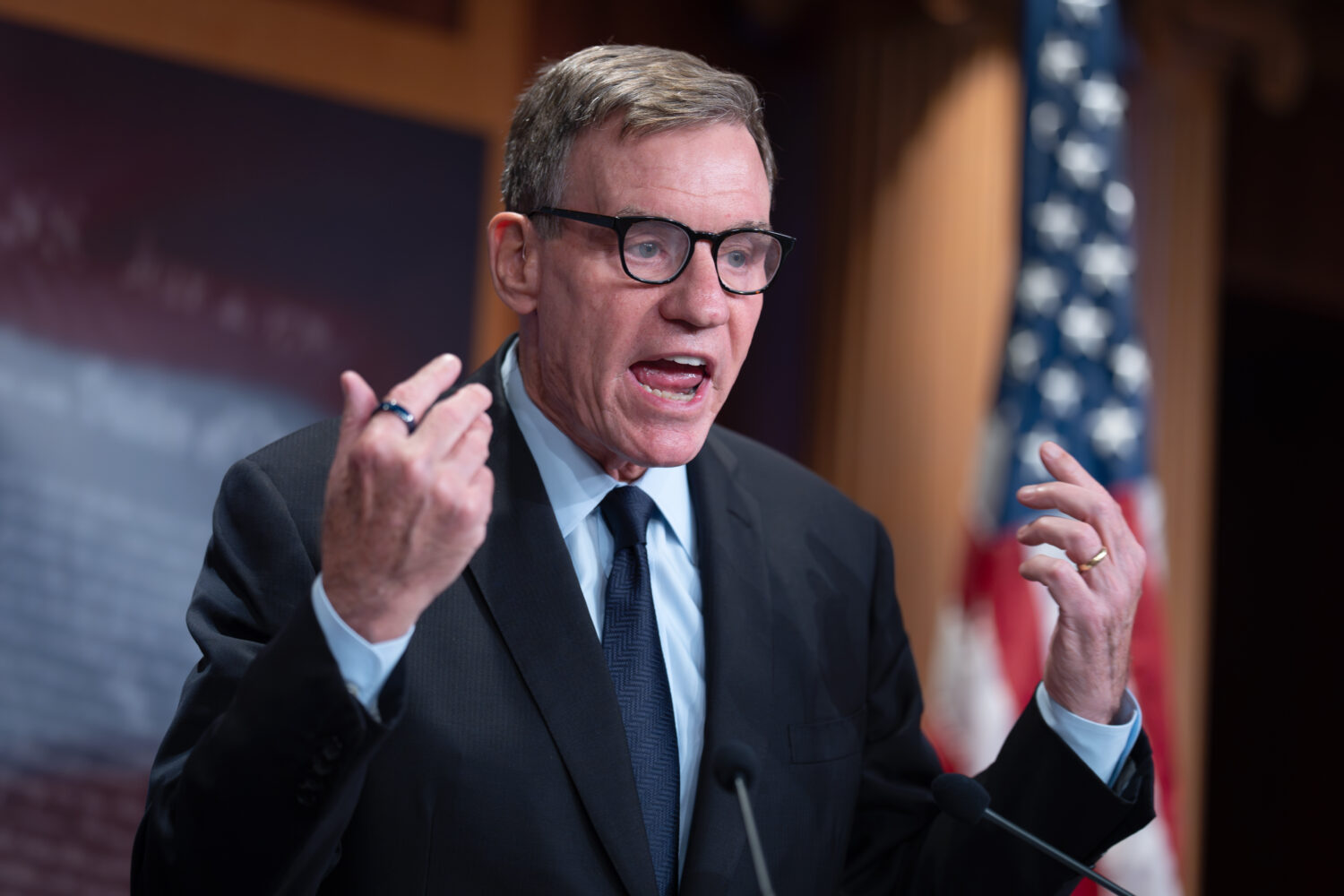 FILE - Sen. Mark Warner, D-Va., the top Democrat on the Senate Intelligence Committee, speaks about...