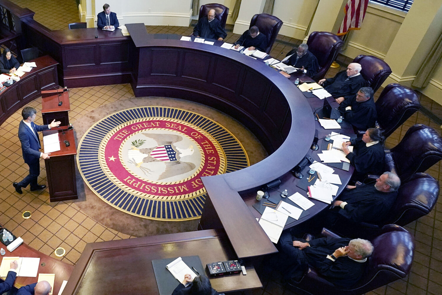 FILE - Mississippi Supreme Court justices, right, listen to arguments in Jackson, Miss., July 6, 20...