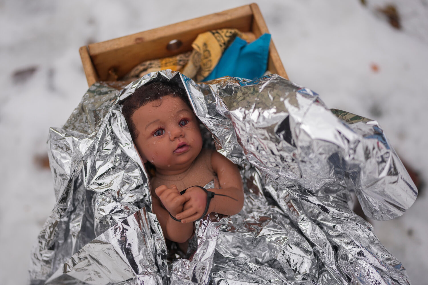 A doll representing the baby Jesus is zip-tied in the Nativity scene outside of Lake Street Church ...