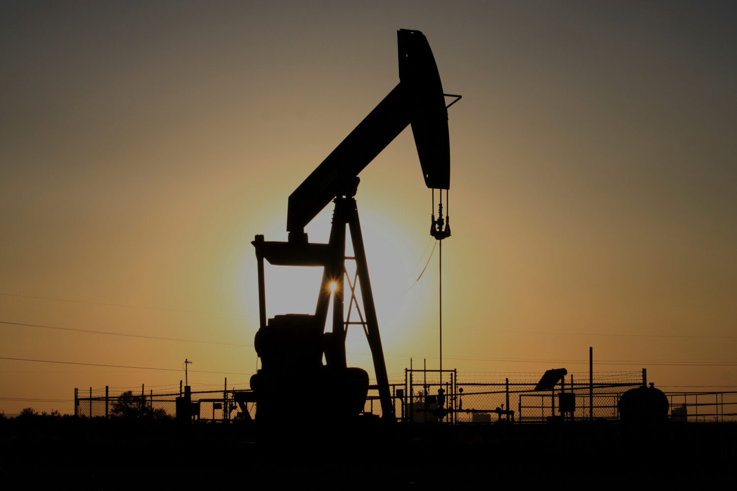 FILE - A pump jack operates at sunset in the Permian Basin near Loving, N.M., May 20, 2025. (AP Pho...