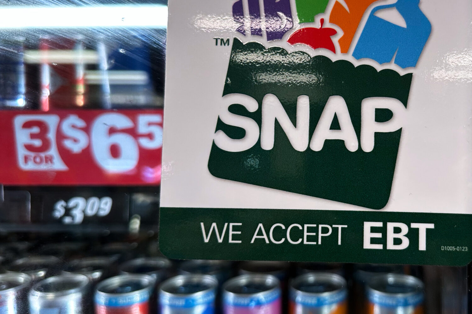 FILE - SNAP EBT information sign is displayed at a gas station in Riverwoods, Ill., Saturday, Nov. ...