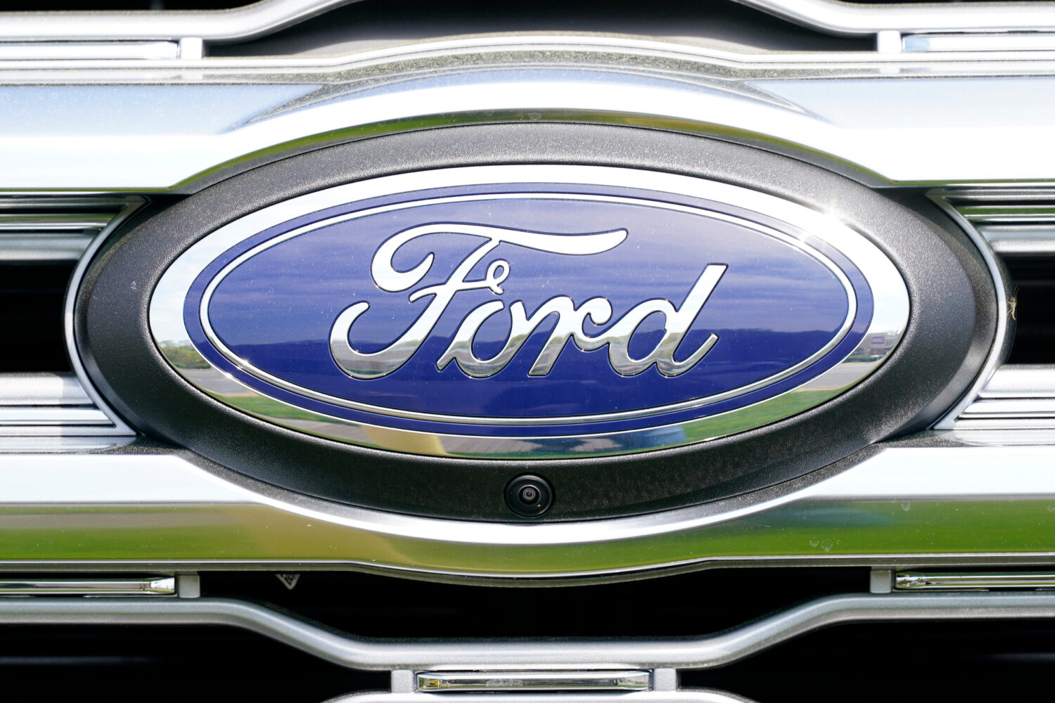 FILE - A logo on a vehicle at a Ford dealership in Springfield, Pa., Tuesday, April 26, 2022. (AP P...
