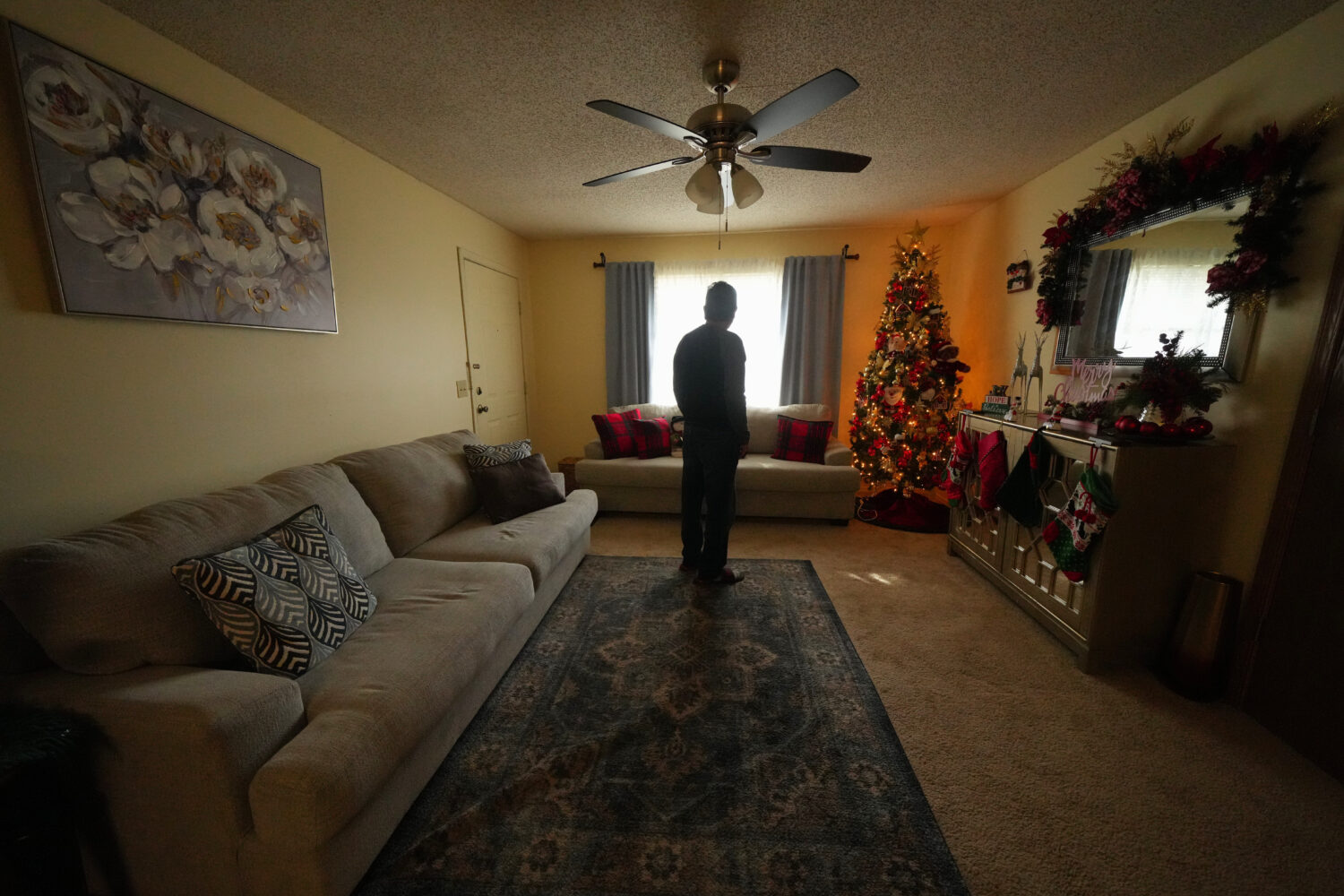 Ernesto, an immigrant from Venezuela, poses for a photograph in his home, Nov. 18, 2025, in Fayette...