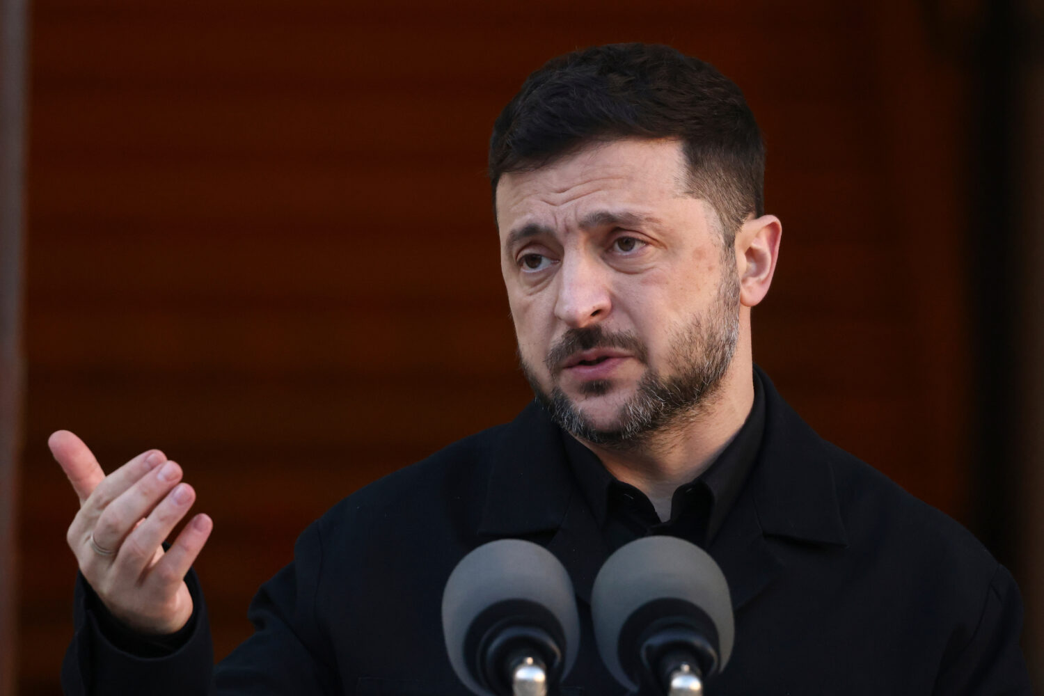 Ukraine President Volodymyr Zelenskyy gestures while speaking as he takes part in a joint news conf...