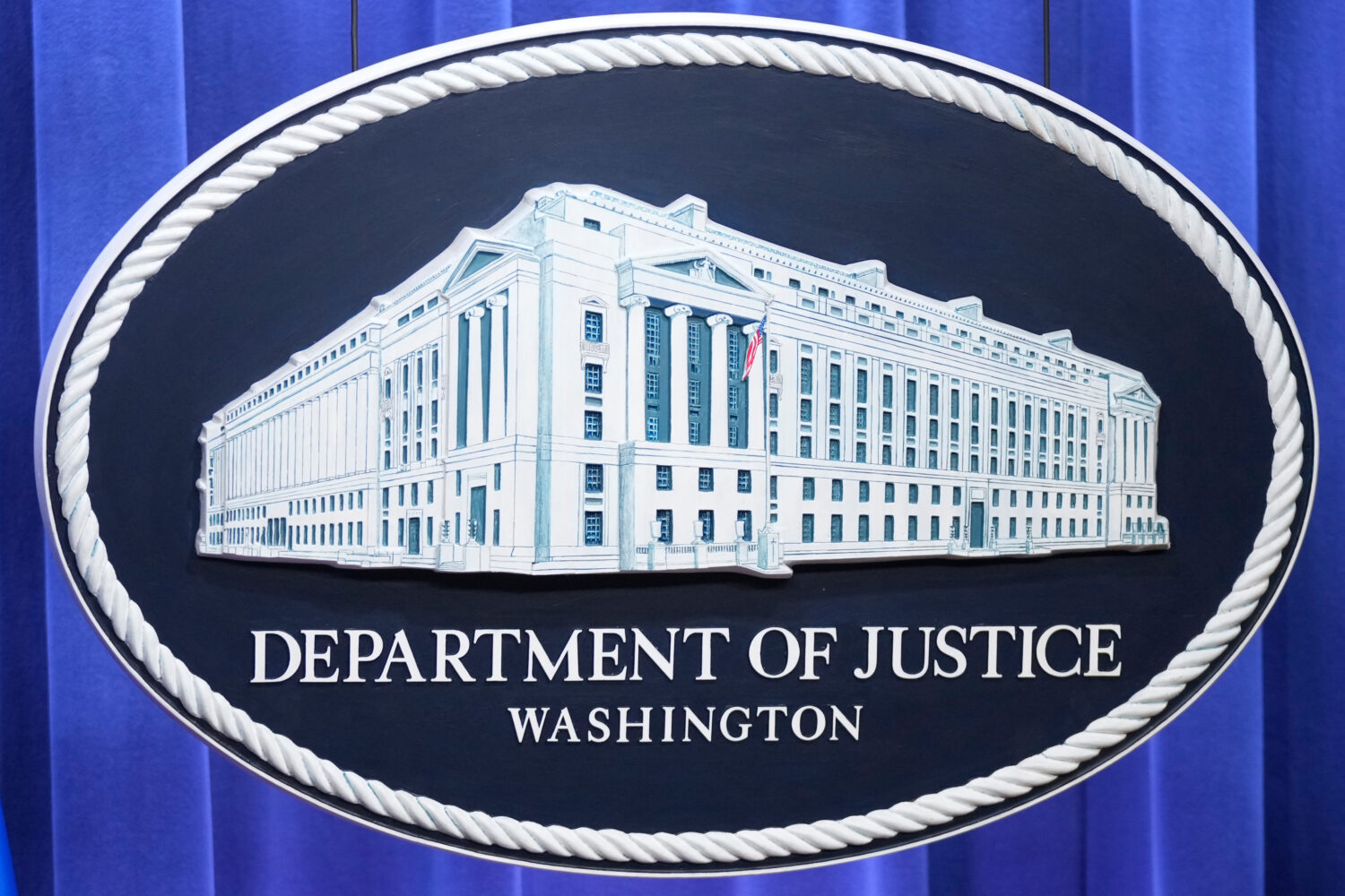 The Department of Justice seal is seen at the Justice Department, Wednesday, Nov. 19, 2025, in Wash...