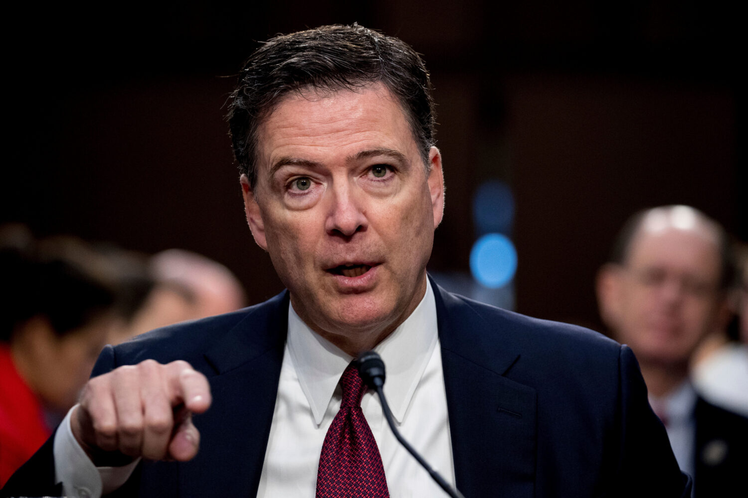 FILE - Former FBI Director James Comey speaks during a Senate Intelligence Committee hearing on Cap...